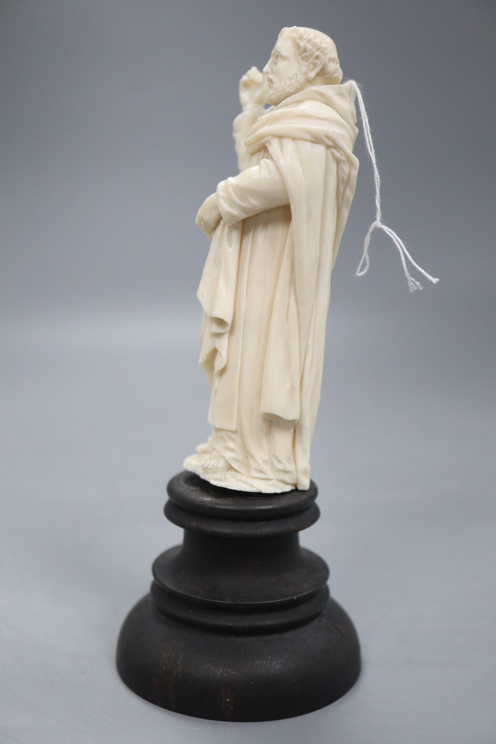 An ivory depiction of the Pope on wooden base, height 17cm